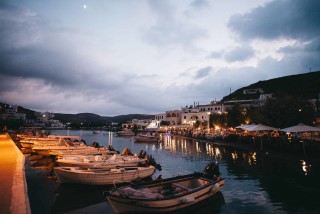 about kythnos porto klaras small fish boats by night overlooking local restaurants at the port