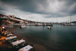 about kythnos porto klaras fish tavern and boats by the sea next to the port