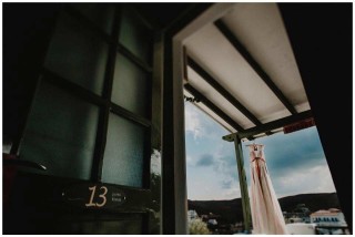 weddings porto klaras bride dress hanging in kythnos balcony