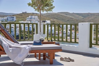 VIP studios porto klaras big balcony with wooden sunbeds and romantic sea view of Kythnos and the Aegean Sea