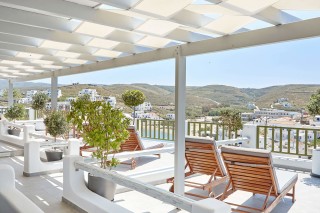 VIP studios porto klaras big sea view balcony with wooden sunbeds and romantic view of Kythnos and the Aegean Sea