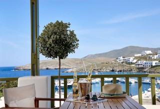 junior suite porto klaras balcony with Aegean Sea view and corona beer