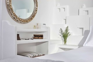 VIP studios porto klaras bedroom amenities, mirror, flowers and cosmetics